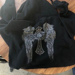 Black zip up jacket with silver angel wings on back